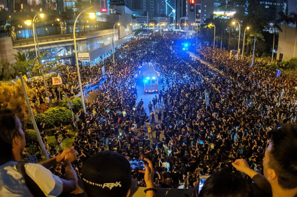 An aerial view of a massive protest in the streets of Hong Kong.